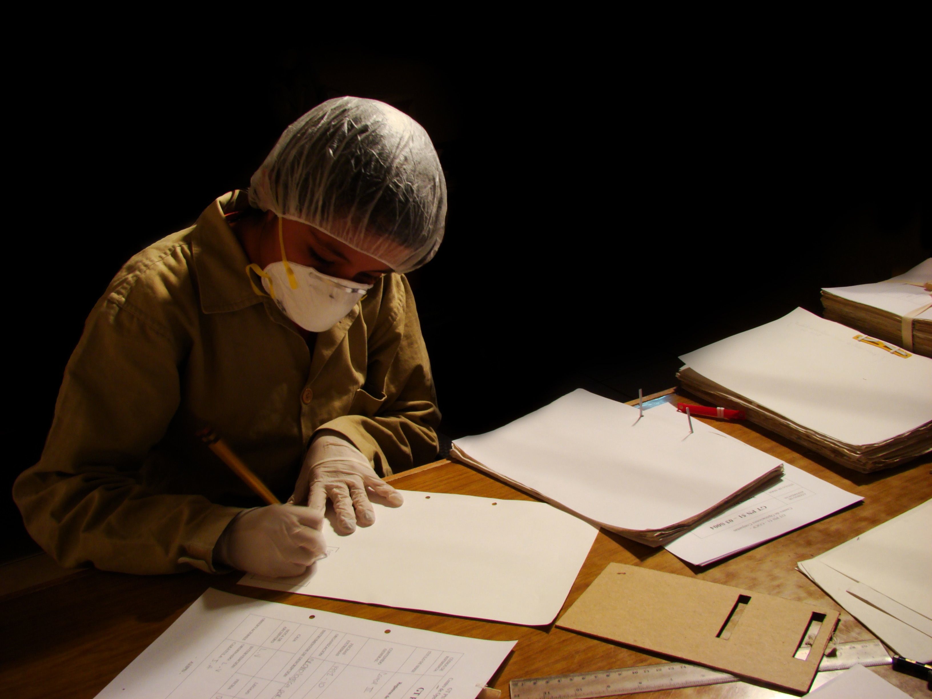 Working with documents at the AHPN. Photo courtesy Archivo Histórico de la Policía Nacional, Guatemala.