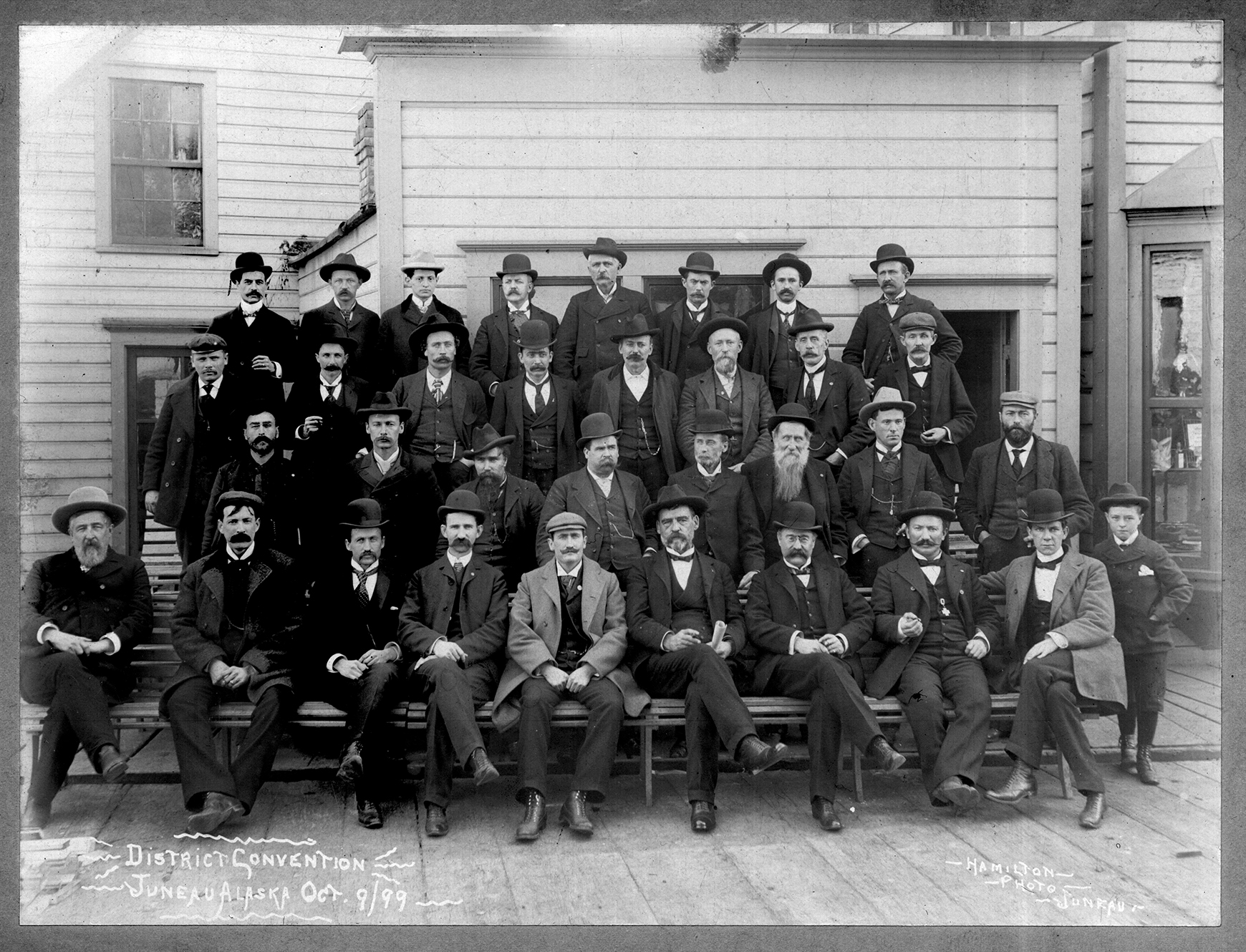 District Convention, Juneau, Alaska, Oct. 9, 1899. Delegates to District Convention pose with their hats on. Juneau-People-17 [detail] Alaska State Library Photo Collection. Courtesy of the Alaska State Library.