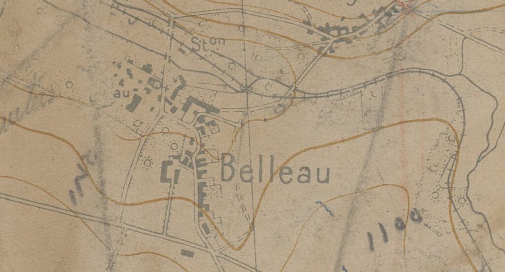 Detail of 1918 map of Château-Thierry, France depicting Belleau, France. The paper is weathered, brown and shows crease marks, with topographic lines, buildings, roads, rail lines, and town name. There are faded notations in black pencil.
